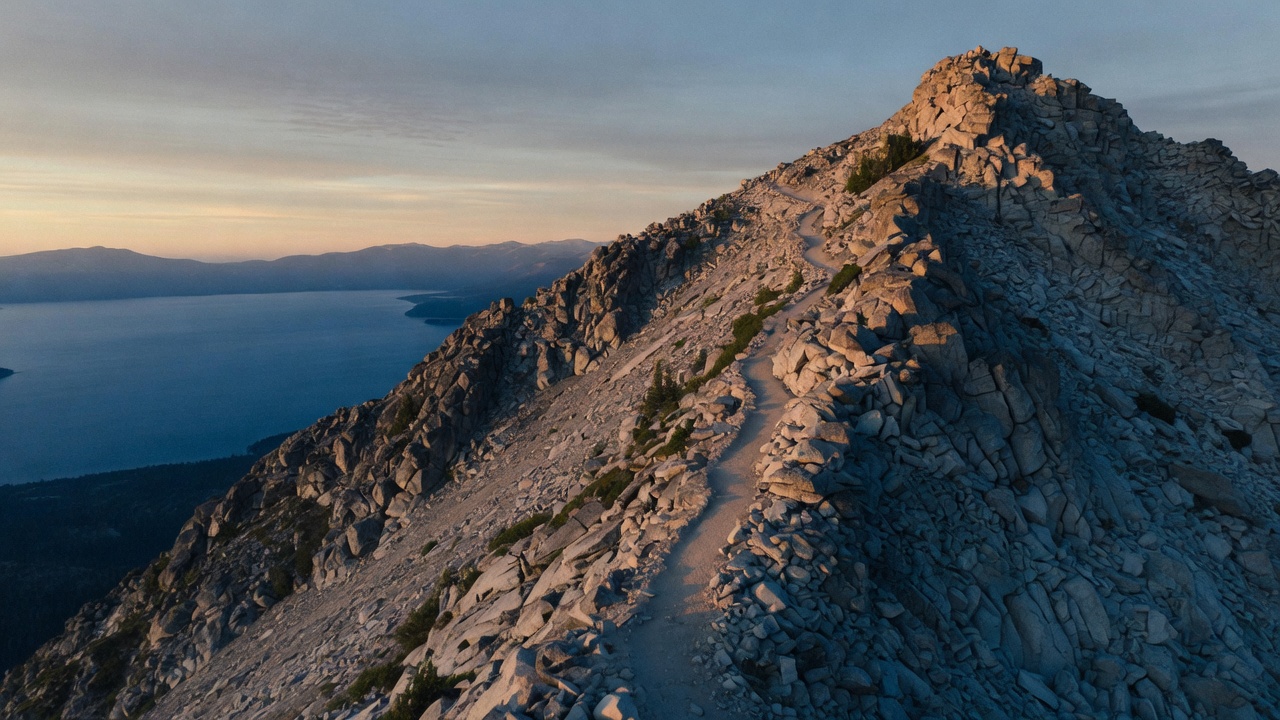 A trail ascending a granite Sierra ridge above Lake Tahoe
